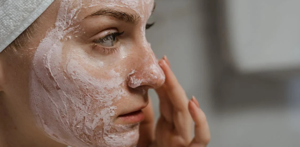 Woman applying exfoliation for winter