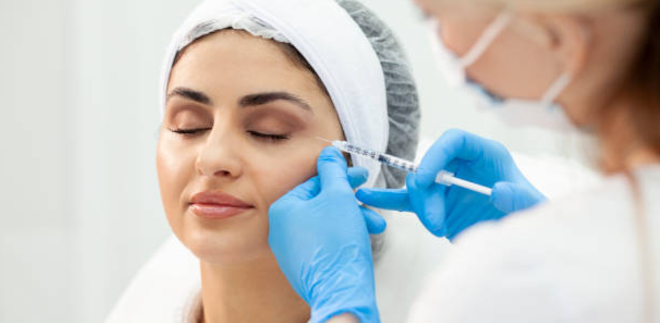 Woman receiving Botox injection near the eye area, perfect for holiday preparations.